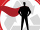 A silhouette of a superhero wearing a cape in front of a recycling symbol.