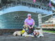 Photo of a veteran and her two dogs who were part of a service dog training organization